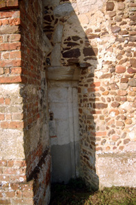 Column set into the angle of the west tower and south wall of the nave January 2011